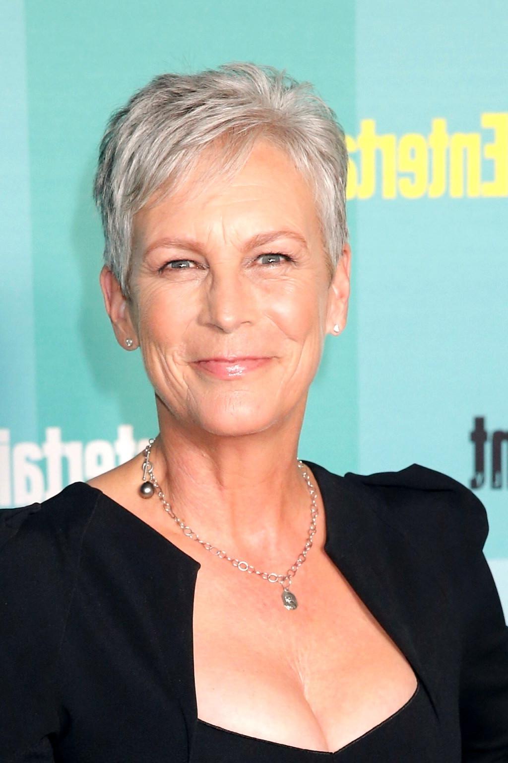 16P Jamie Lee Curtis shows cleavage wearing a low cut dress