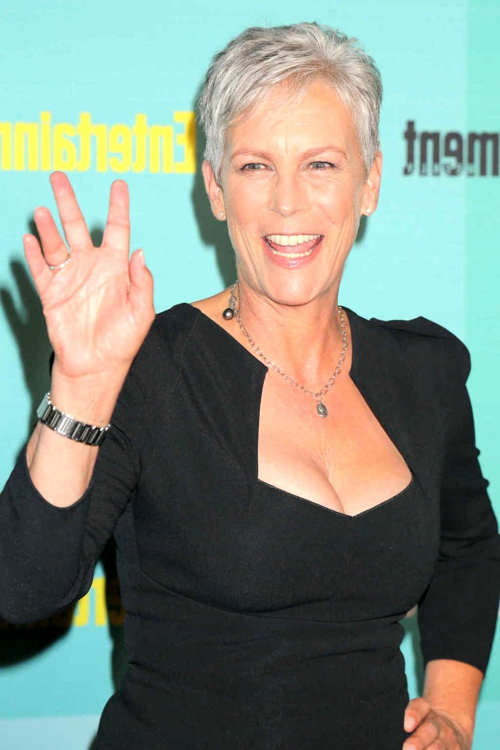 16P Jamie Lee Curtis shows cleavage wearing a low cut dress
