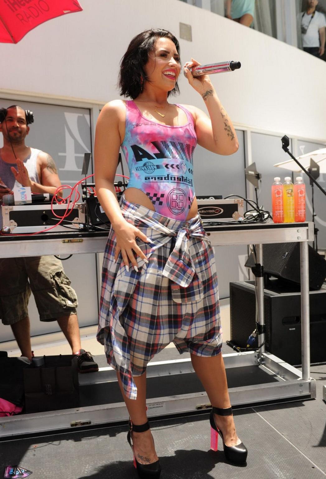 16P Demi Lovato performing in skimpy swimsuit poolside
