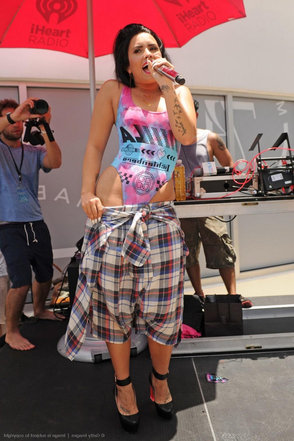 16P Demi Lovato performing in skimpy swimsuit poolside