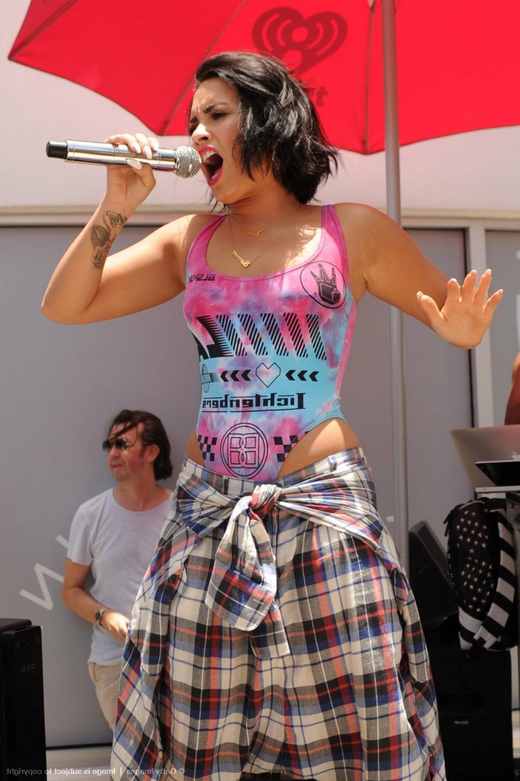 16P Demi Lovato performing in skimpy swimsuit poolside