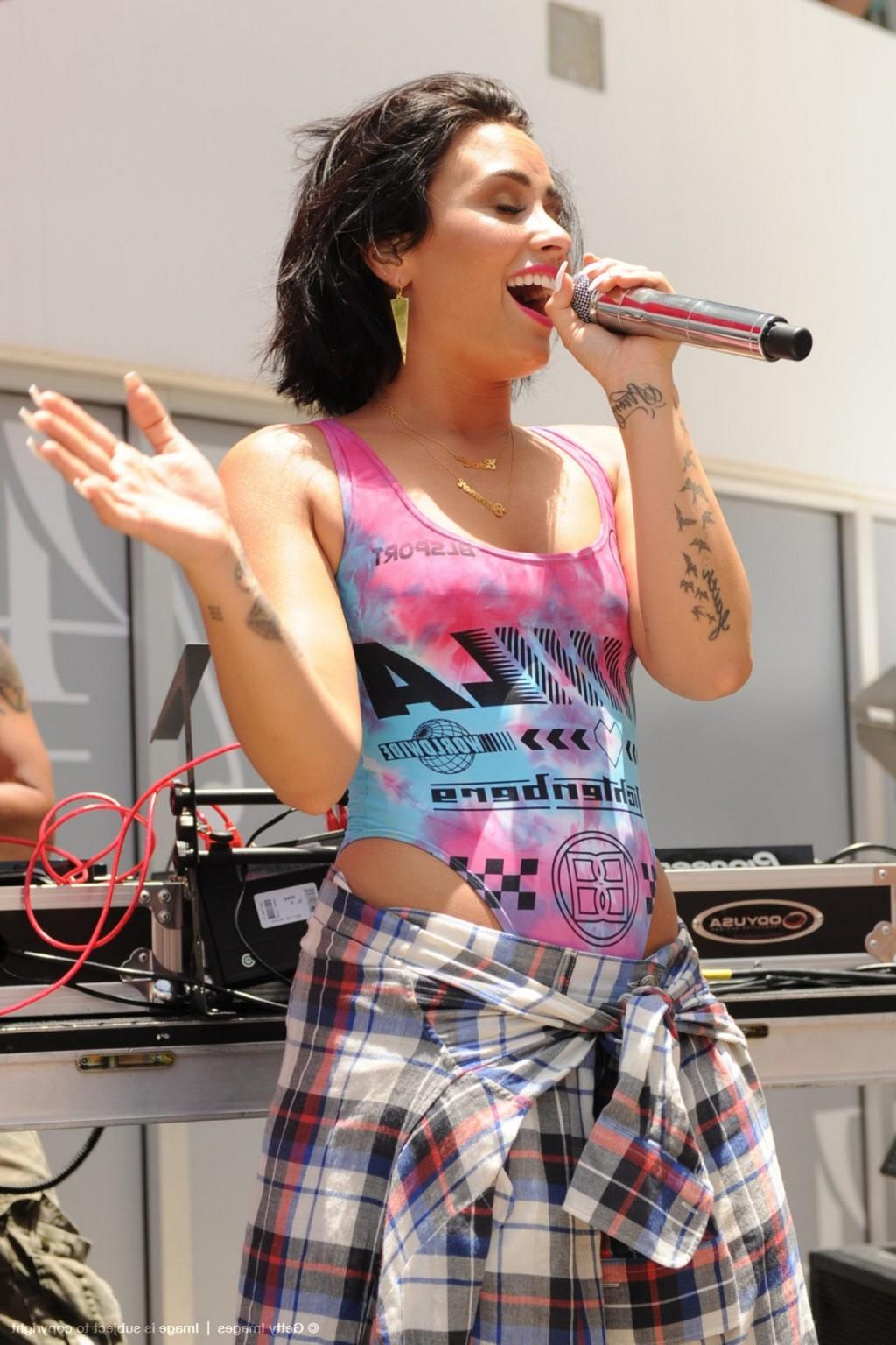 16P Demi Lovato performing in skimpy swimsuit poolside