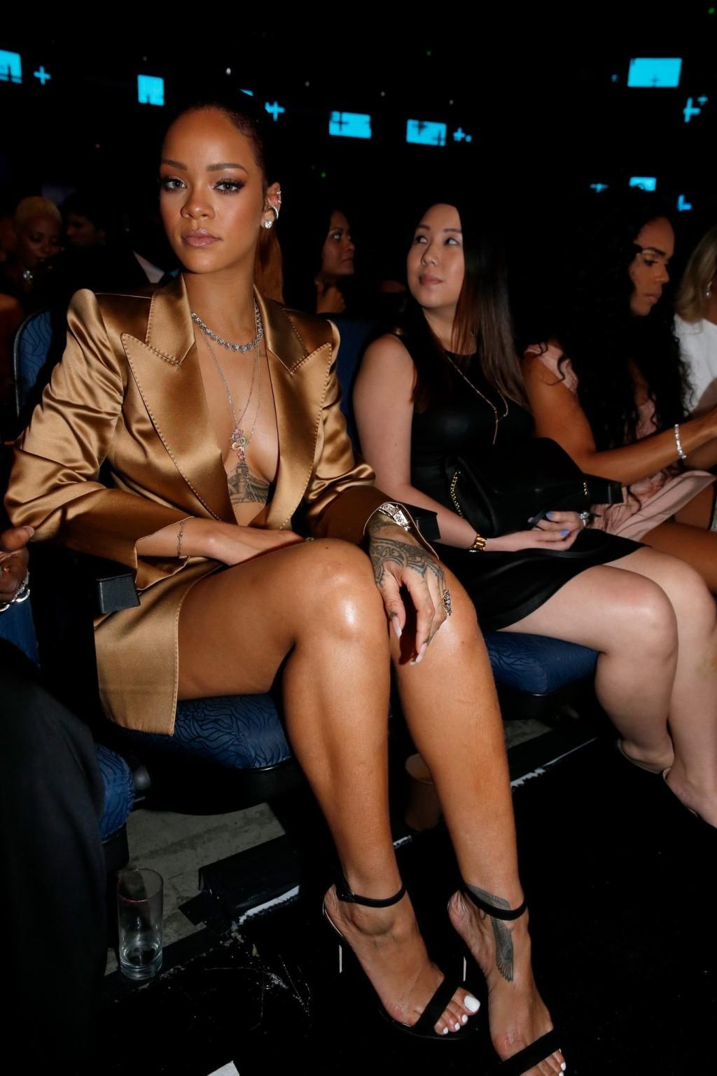 16P Rihanna braless wearing a wide open jacket at the BET Awards