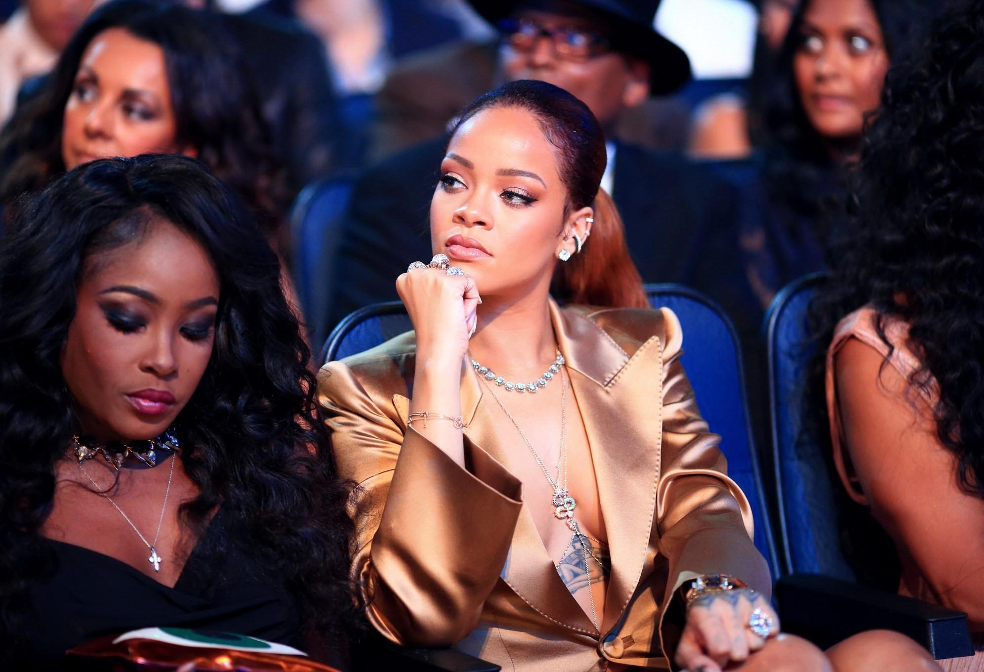 16P Rihanna braless wearing a wide open jacket at the BET Awards