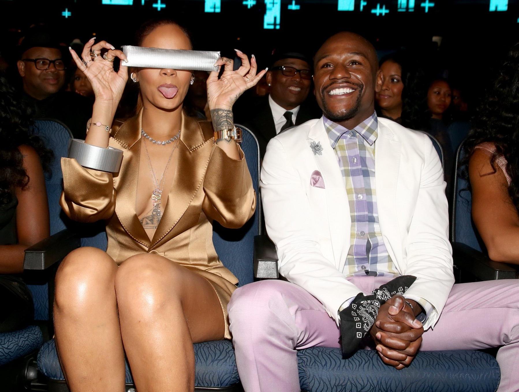 16P Rihanna braless wearing a wide open jacket at the BET Awards