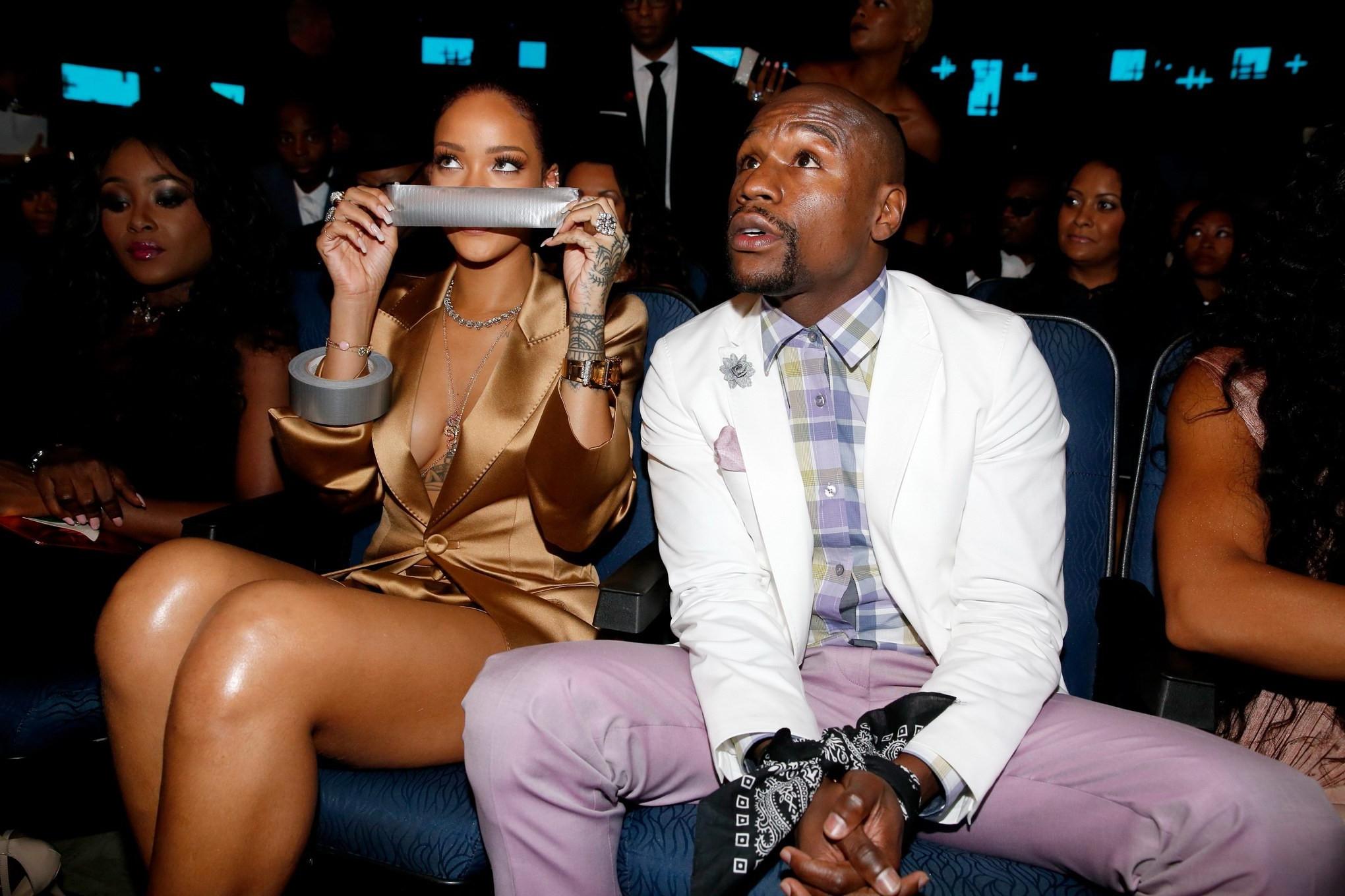 16P Rihanna braless wearing a wide open jacket at the BET Awards