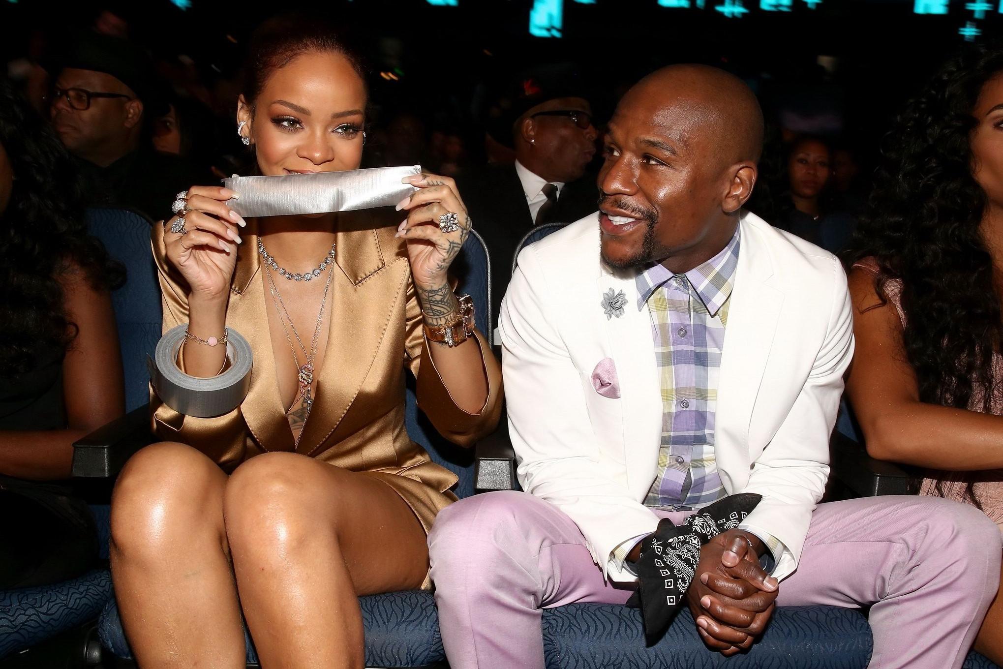 16P Rihanna braless wearing a wide open jacket at the BET Awards