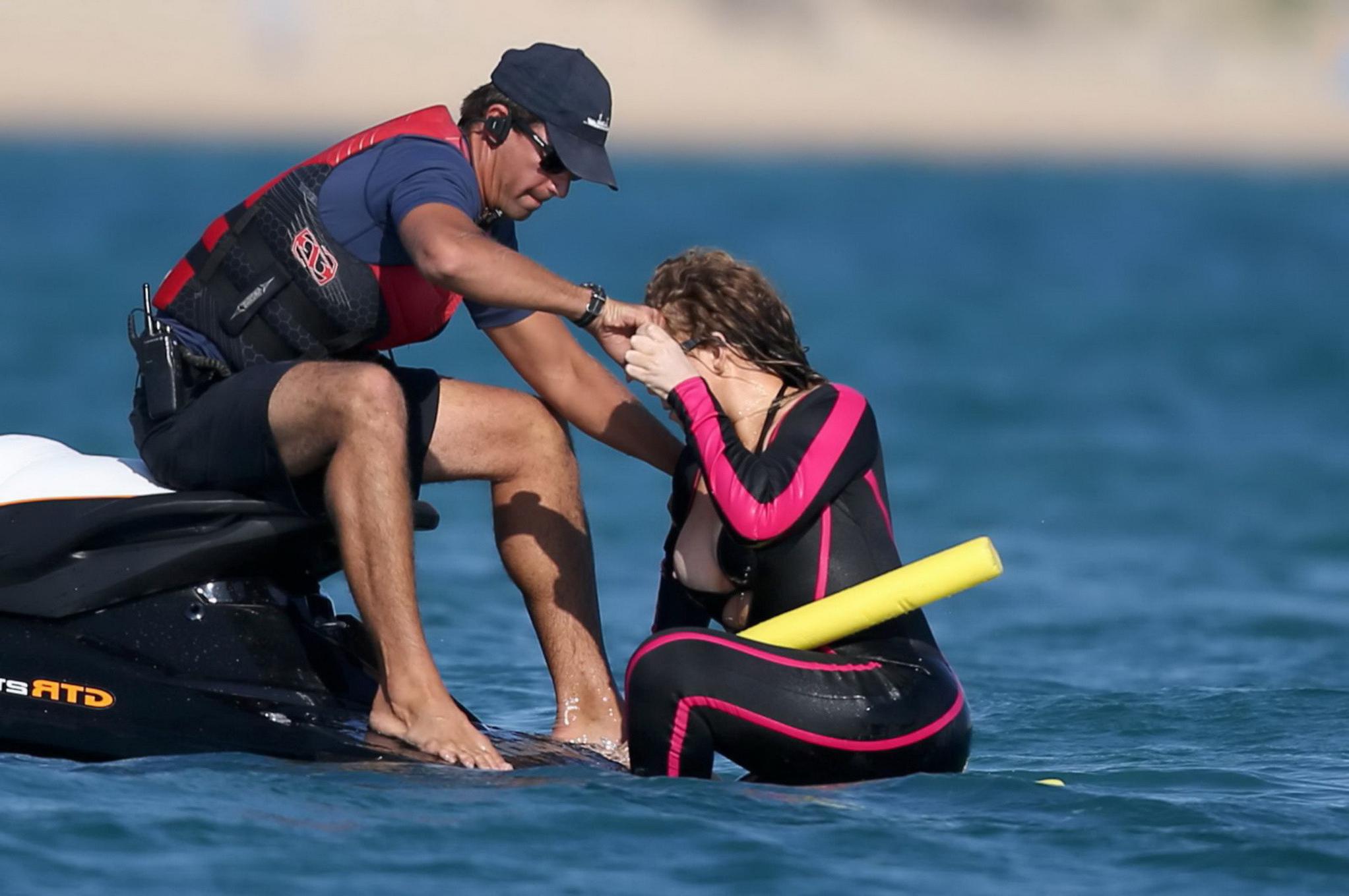 16P Mariah Carey hot boob slip at the beach in Sardinia
