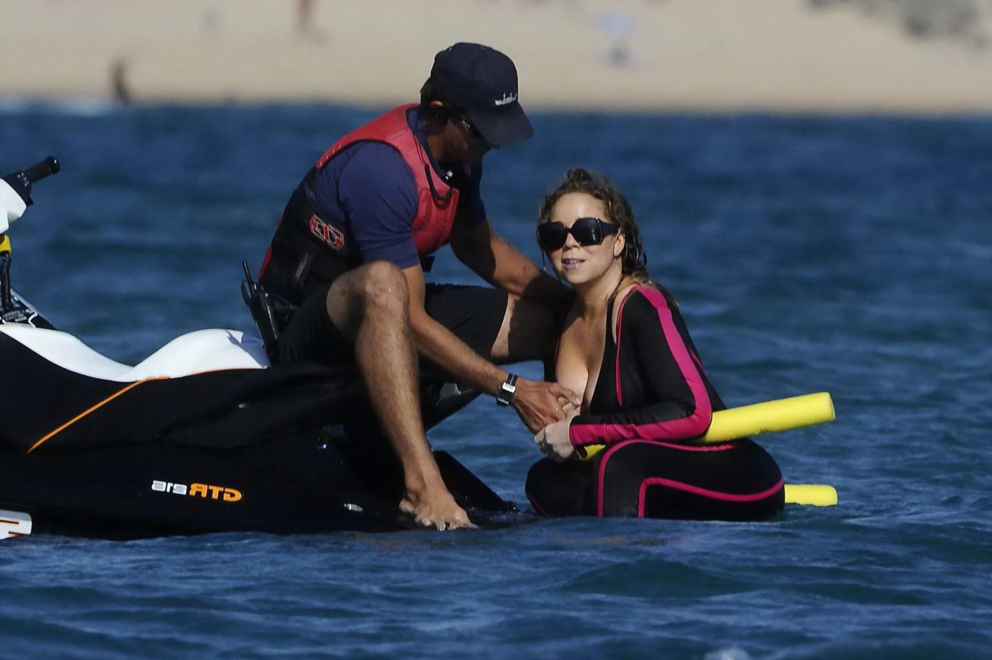 16P Mariah Carey hot boob slip at the beach in Sardinia