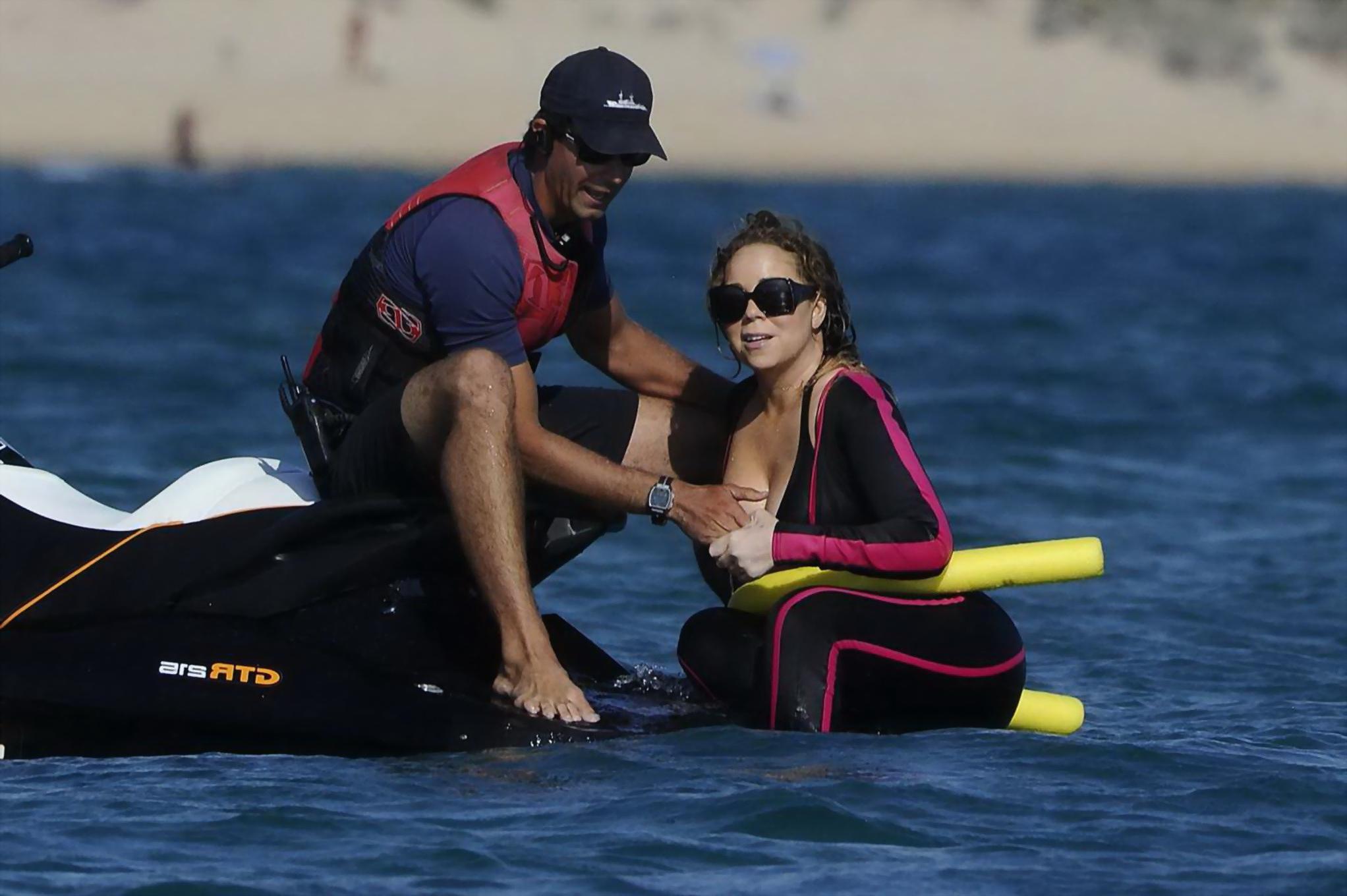 16P Mariah Carey hot boob slip at the beach in Sardinia