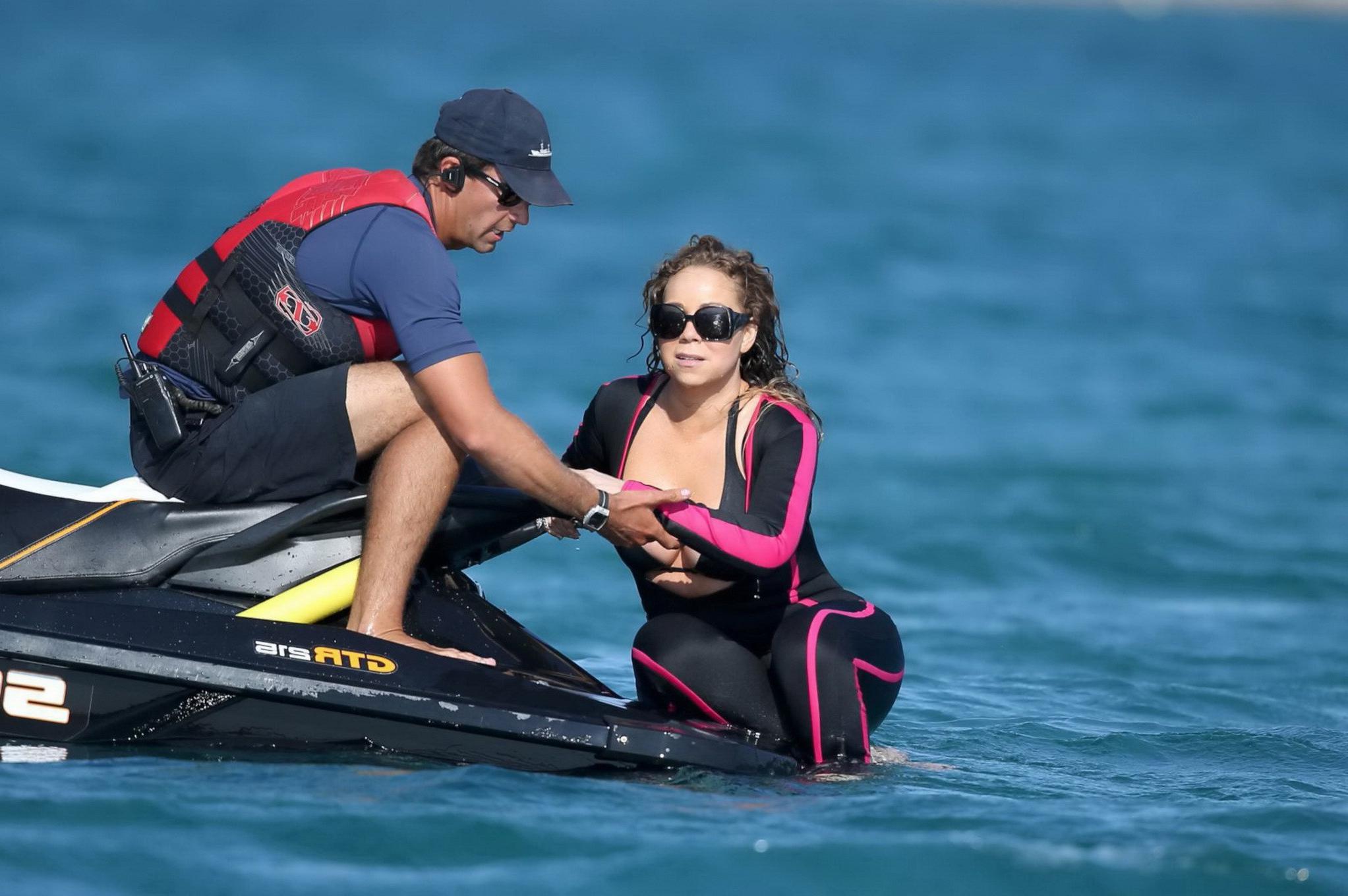 16P Mariah Carey hot boob slip at the beach in Sardinia