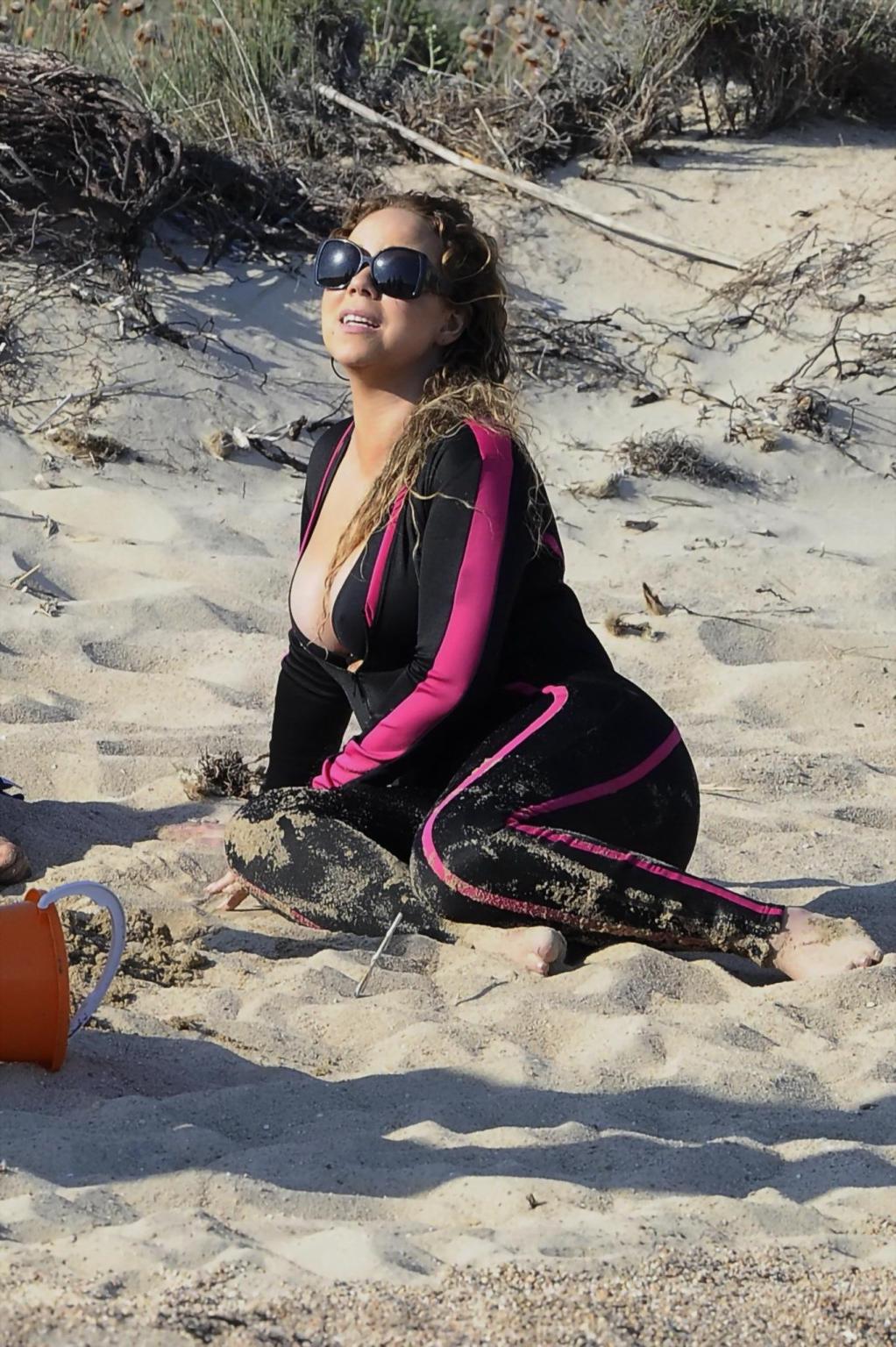 16P Mariah Carey hot boob slip at the beach in Sardinia