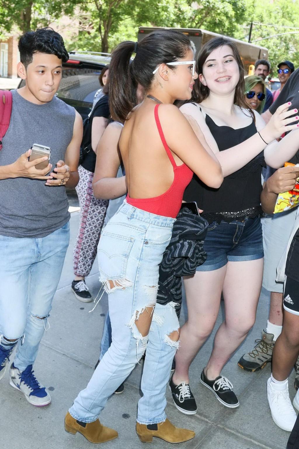 16P Selena Gomez showing boobs and pokies in a seethrough bodysuit
