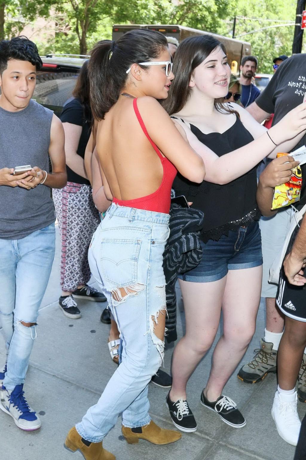 16P Selena Gomez showing boobs and pokies in a seethrough bodysuit