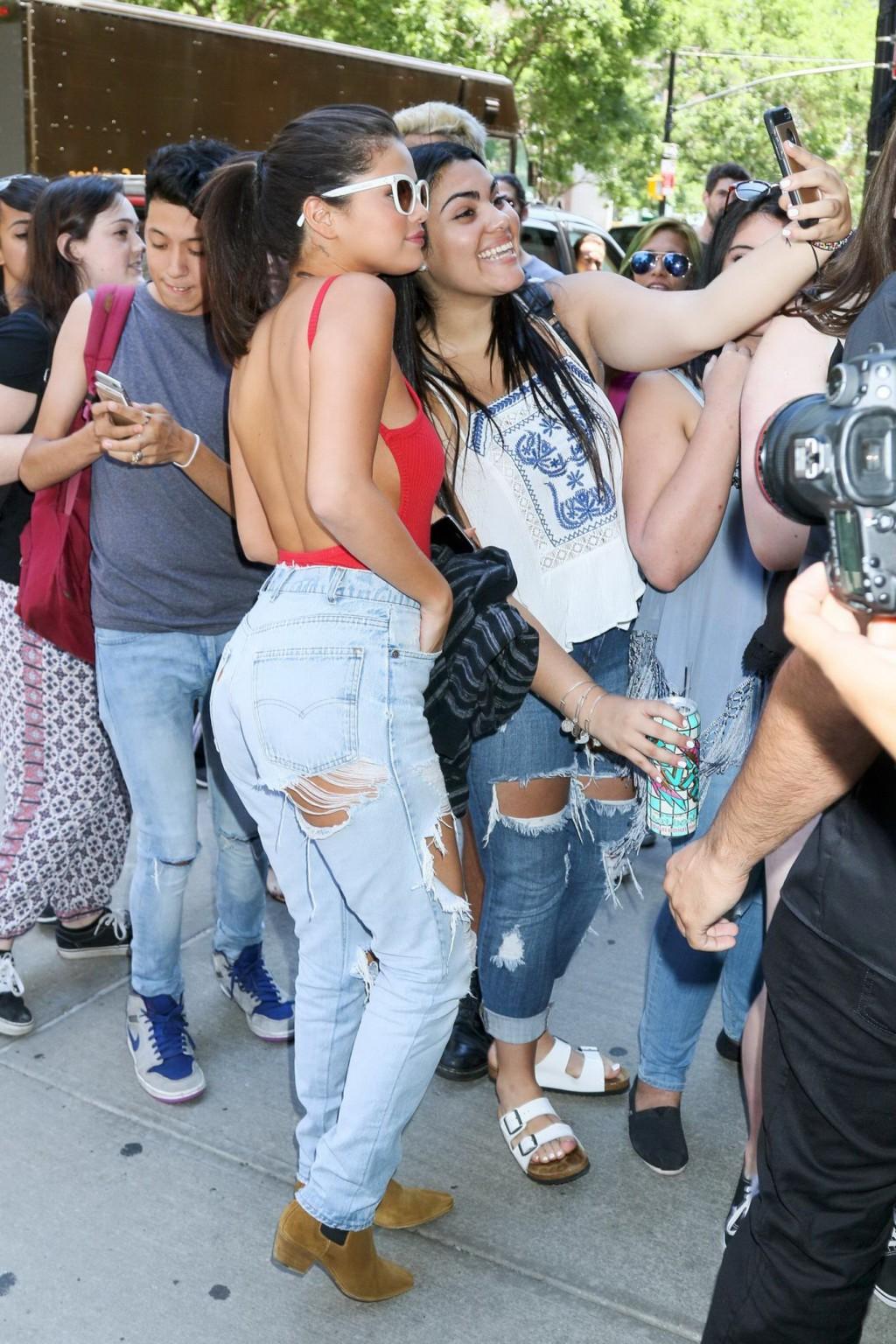 16P Selena Gomez showing boobs and pokies in a seethrough bodysuit