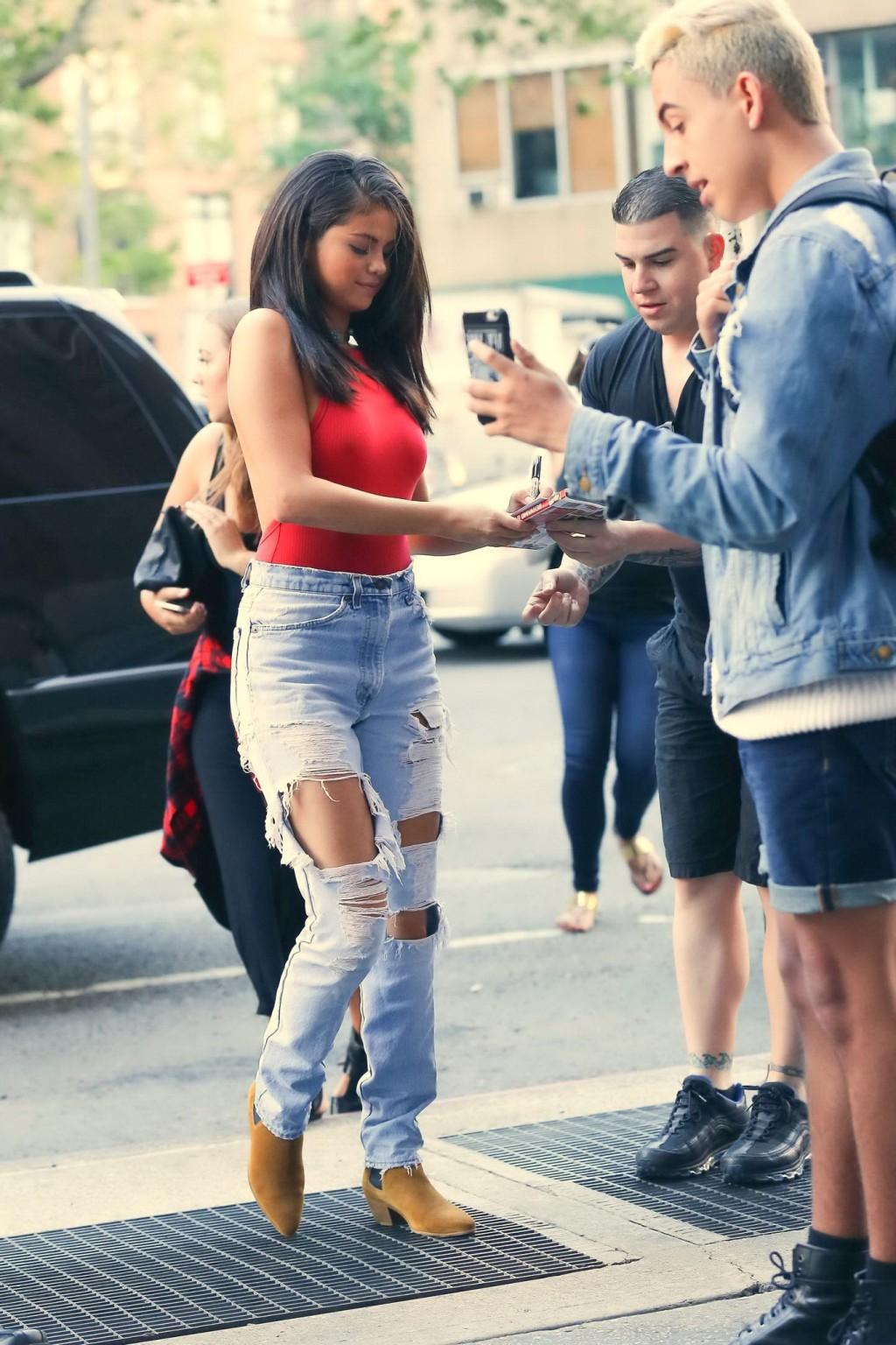 16P Selena Gomez showing boobs and pokies in a seethrough bodysuit
