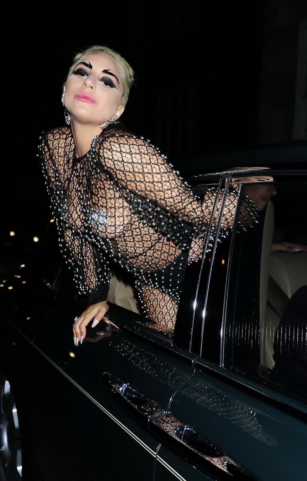 16P Lady Gaga bares all in a seethrough jewelled jumpsuit with nipple tassels