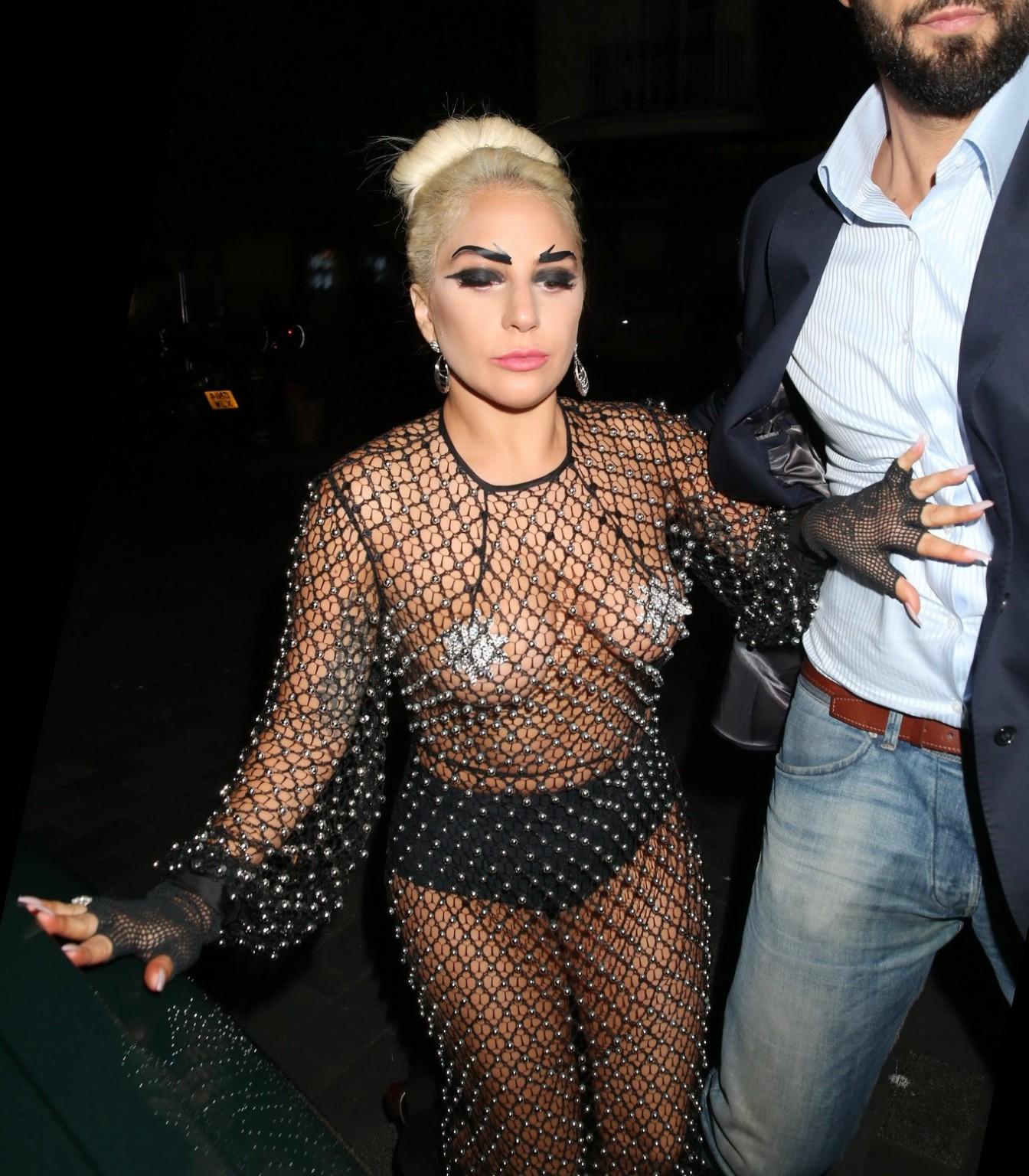 16P Lady Gaga bares all in a seethrough jewelled jumpsuit with nipple tassels