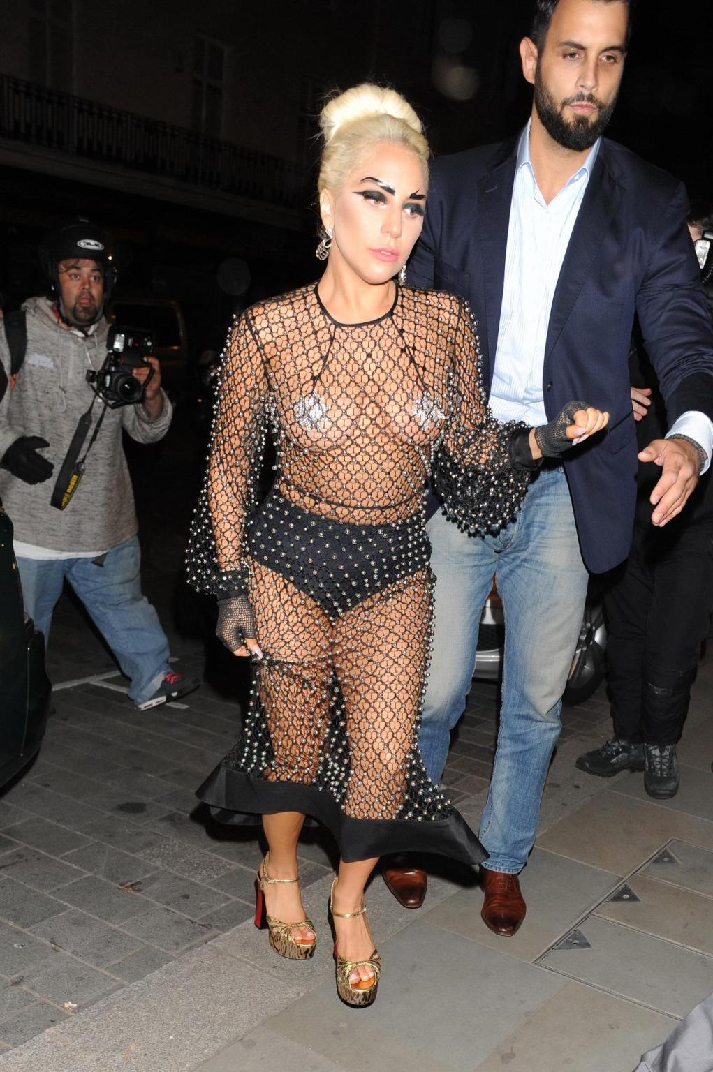 16P Lady Gaga bares all in a seethrough jewelled jumpsuit with nipple tassels