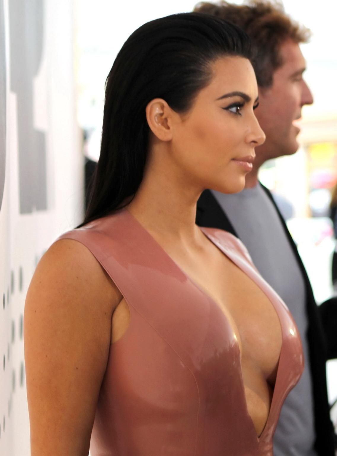 16P Kim Kardashian shows off her curvy body wearing a tight latex dress at Hype Ener
