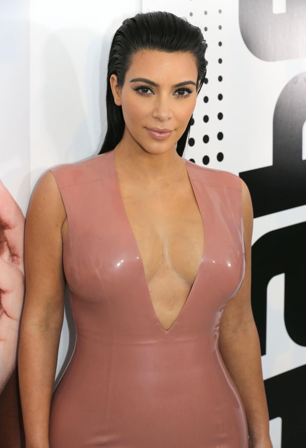 16P Kim Kardashian shows off her curvy body wearing a tight latex dress at Hype Ener