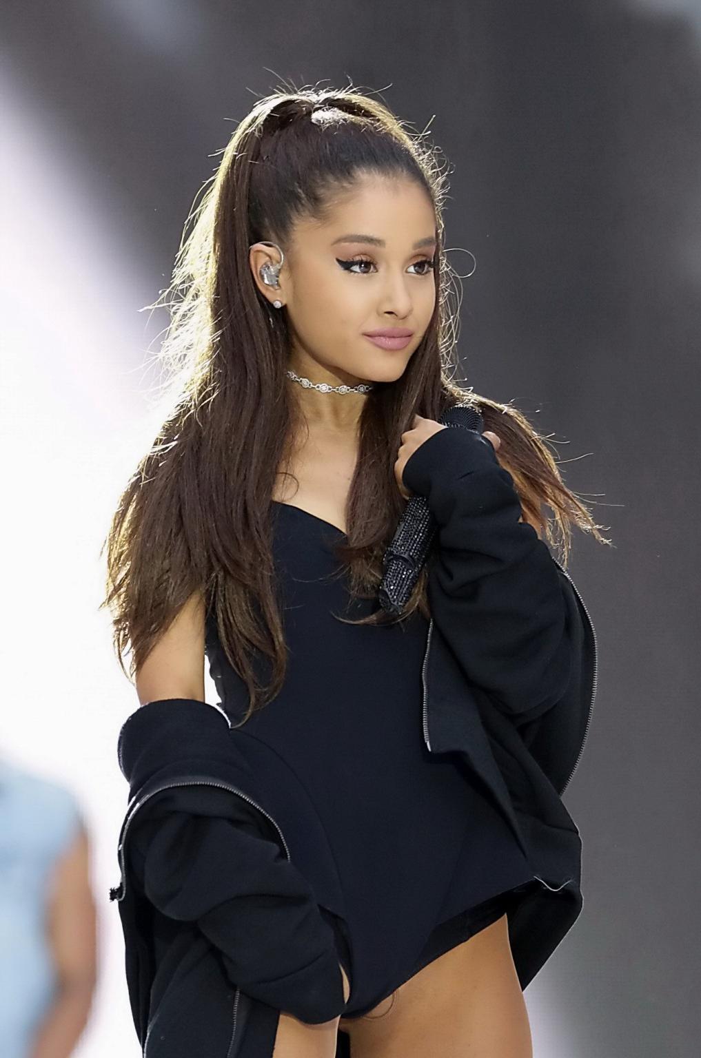 16P Ariana Grande shows off her shaved pussy in a tiny black outfit while performing