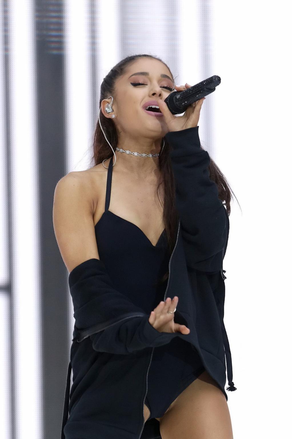16P Ariana Grande shows off her shaved pussy in a tiny black outfit while performing