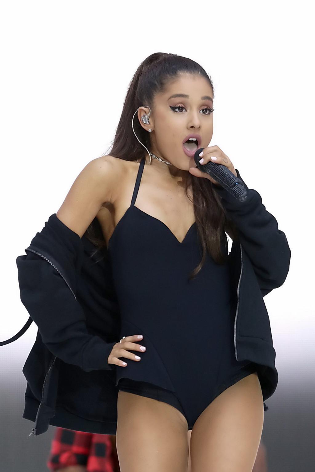 16P Ariana Grande shows off her shaved pussy in a tiny black outfit while performing