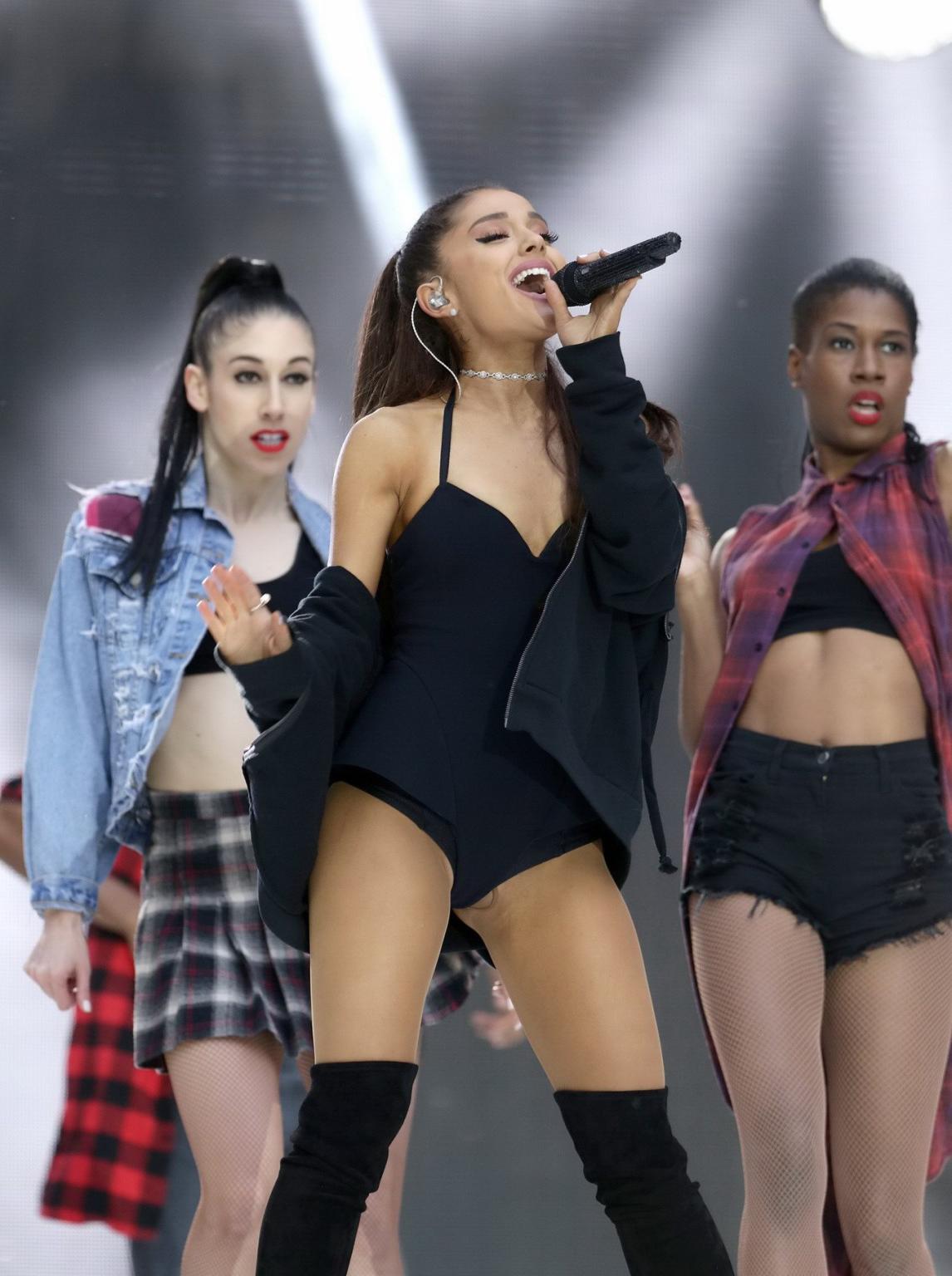 16P Ariana Grande shows off her shaved pussy in a tiny black outfit while performing