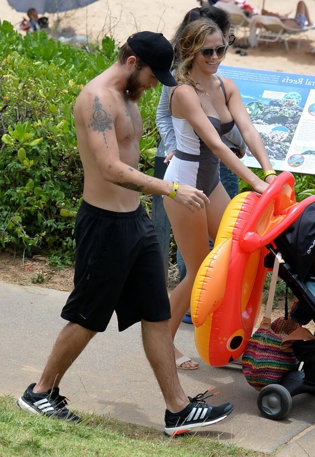 16P Teresa Palmer busty wearing a low cut swimsuit on a Hawaiian beach