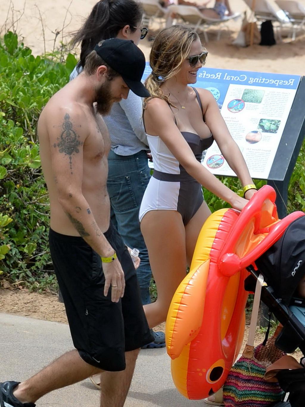 16P Teresa Palmer busty wearing a low cut swimsuit on a Hawaiian beach