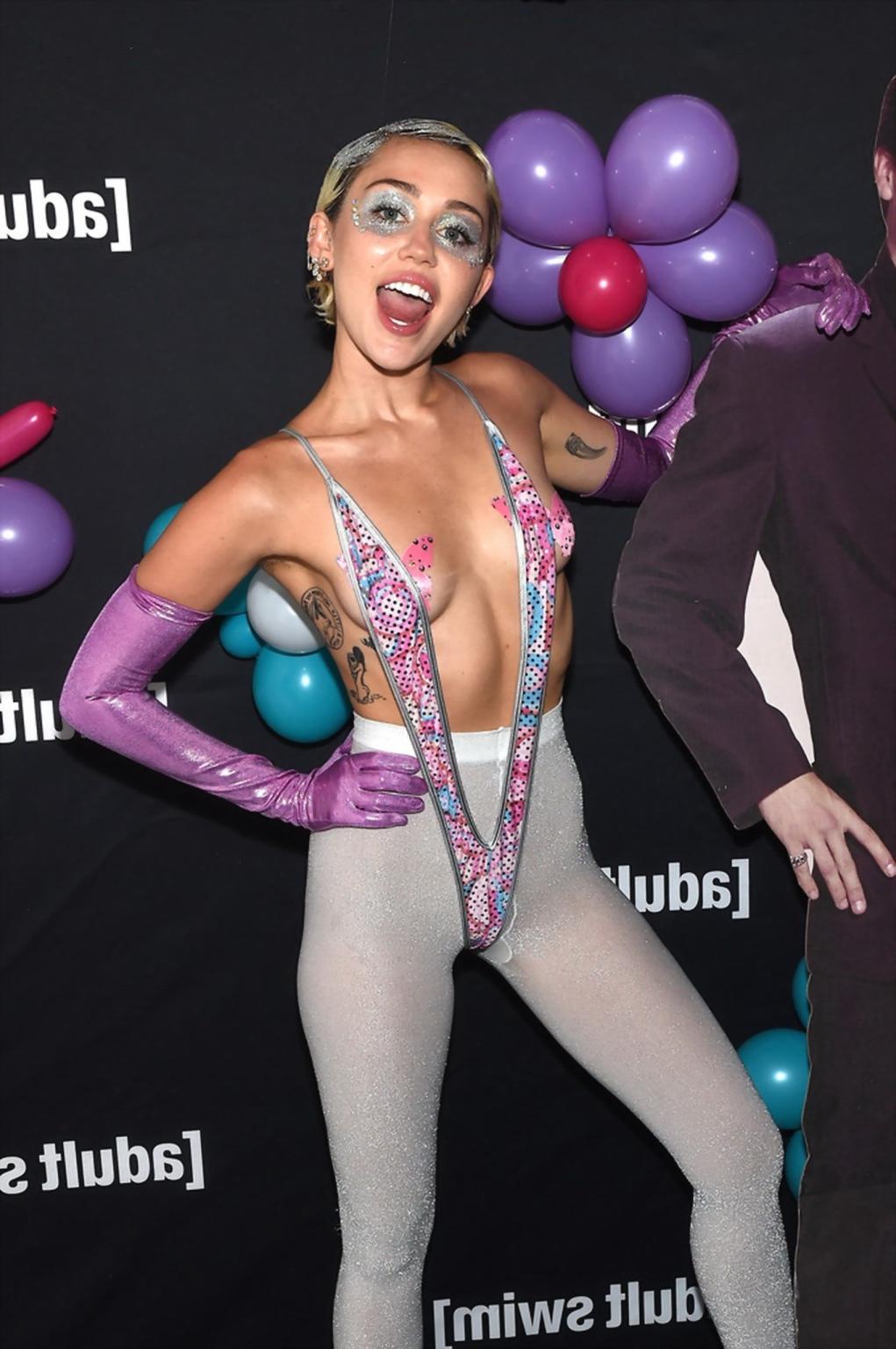 16P Miley Cyrus topless wearing butterfly pasties and pantyhose while performing at 