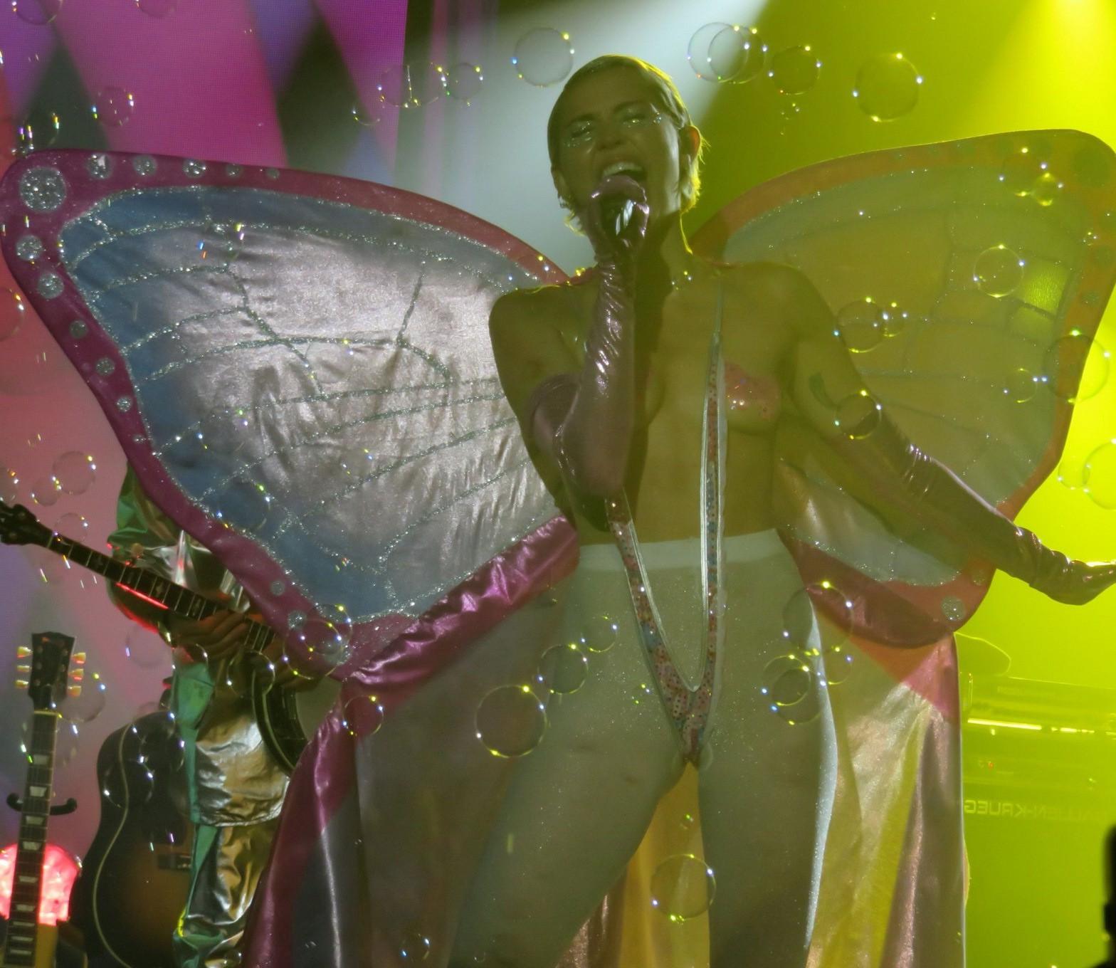 16P Miley Cyrus topless wearing butterfly pasties and pantyhose while performing at 