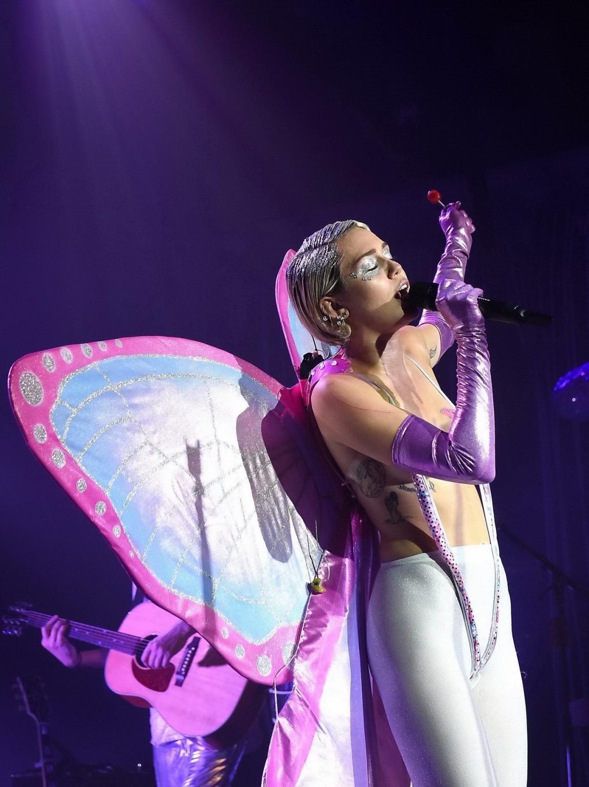 16P Miley Cyrus topless wearing butterfly pasties and pantyhose while performing at 