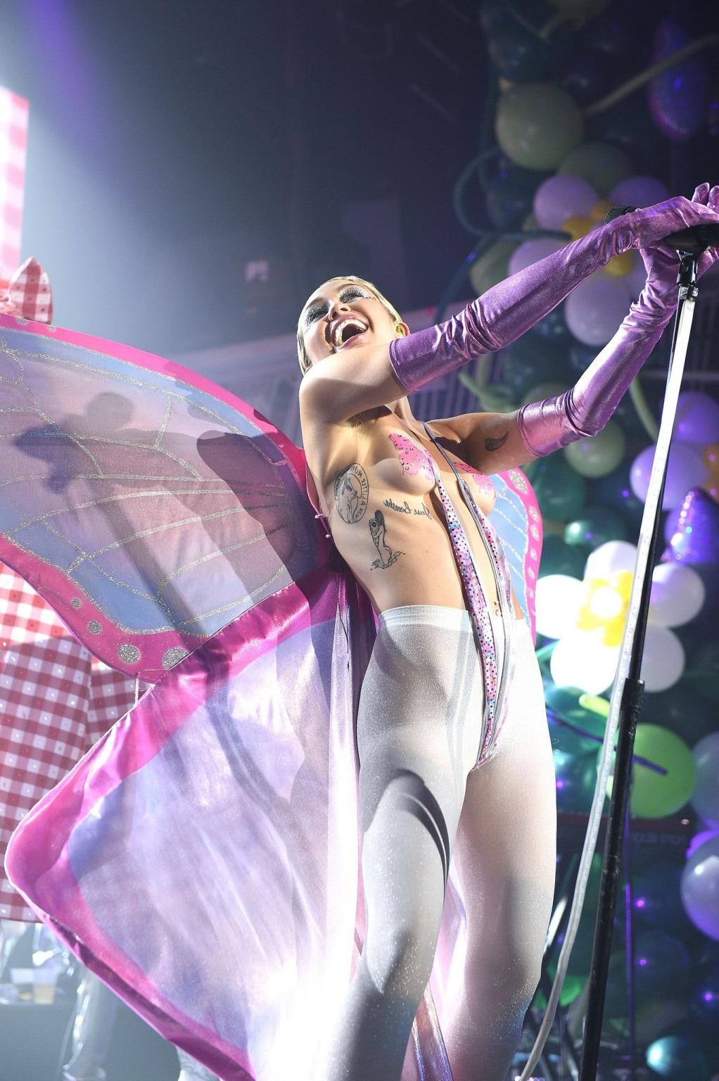 16P Miley Cyrus topless wearing butterfly pasties and pantyhose while performing at 