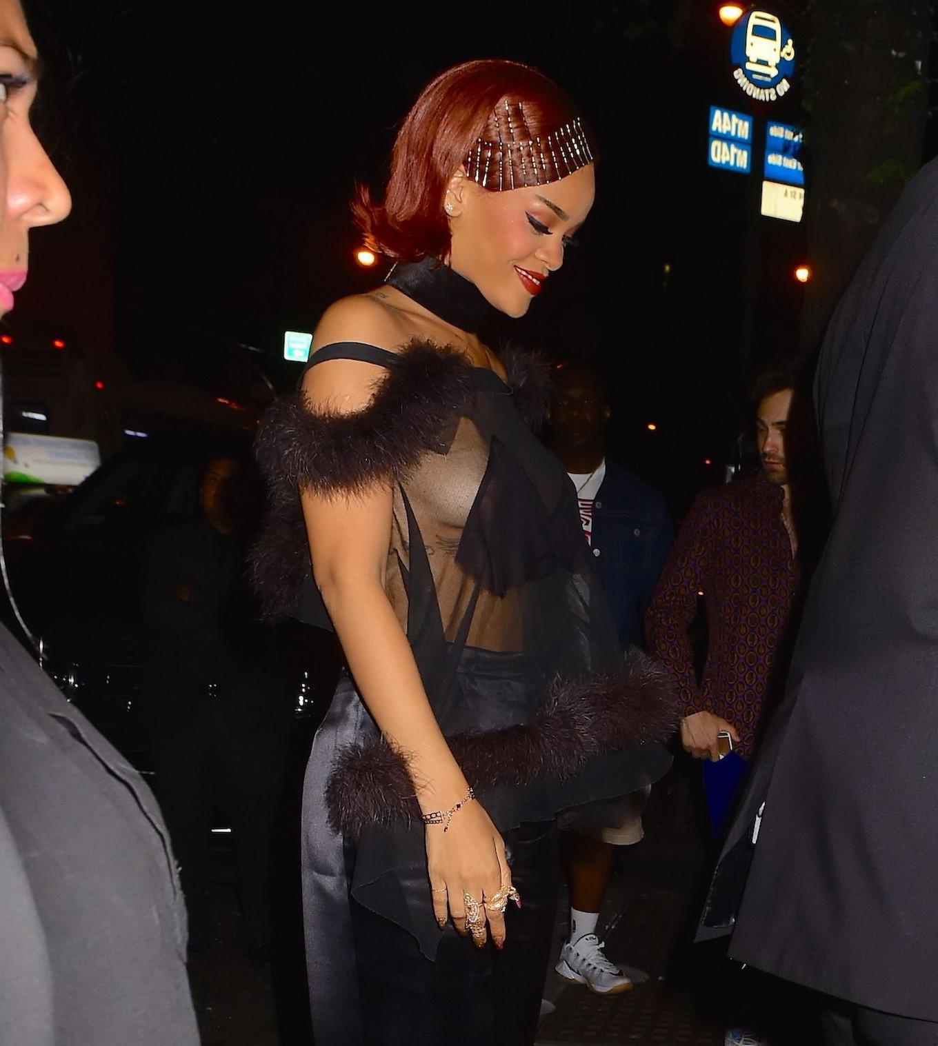 16P Rihanna showing off her boobs braless in a see through top at Met Gala After Par