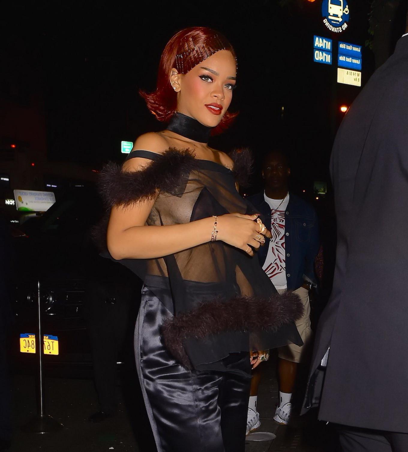 16P Rihanna showing off her boobs braless in a see through top at Met Gala After Par