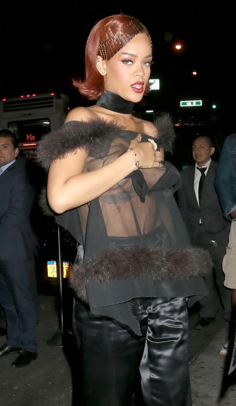 16P Rihanna showing off her boobs braless in a see through top at Met Gala After Par