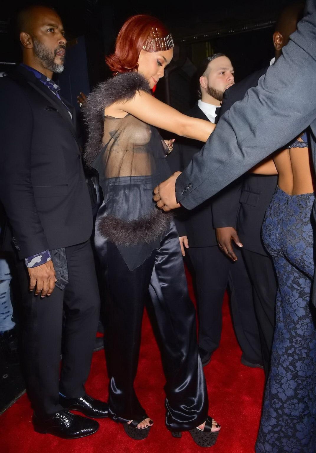 16P Rihanna showing off her boobs braless in a see through top at Met Gala After Par
