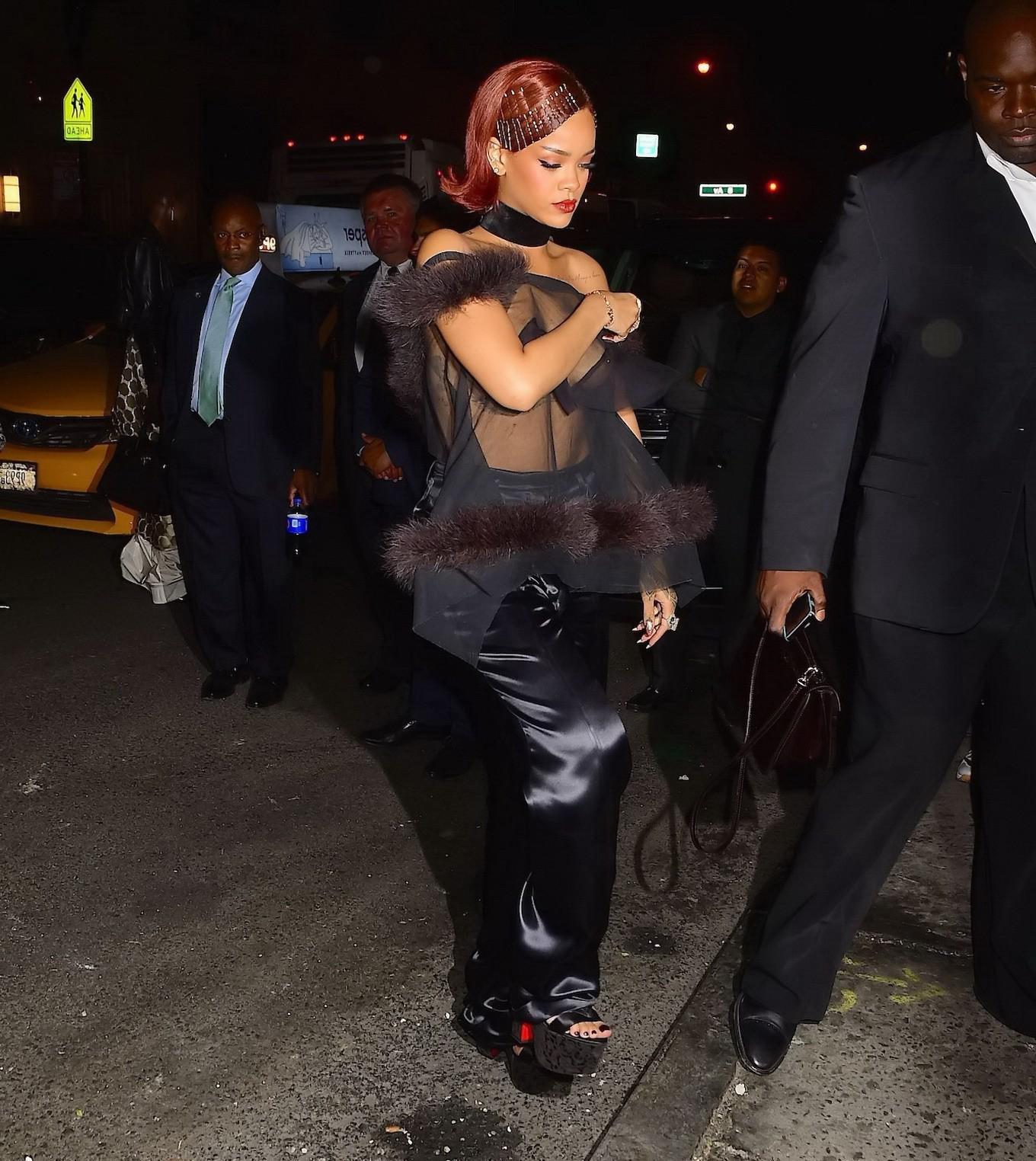 16P Rihanna showing off her boobs braless in a see through top at Met Gala After Par