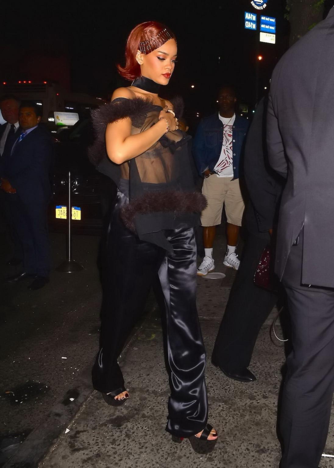 16P Rihanna showing off her boobs braless in a see through top at Met Gala After Par