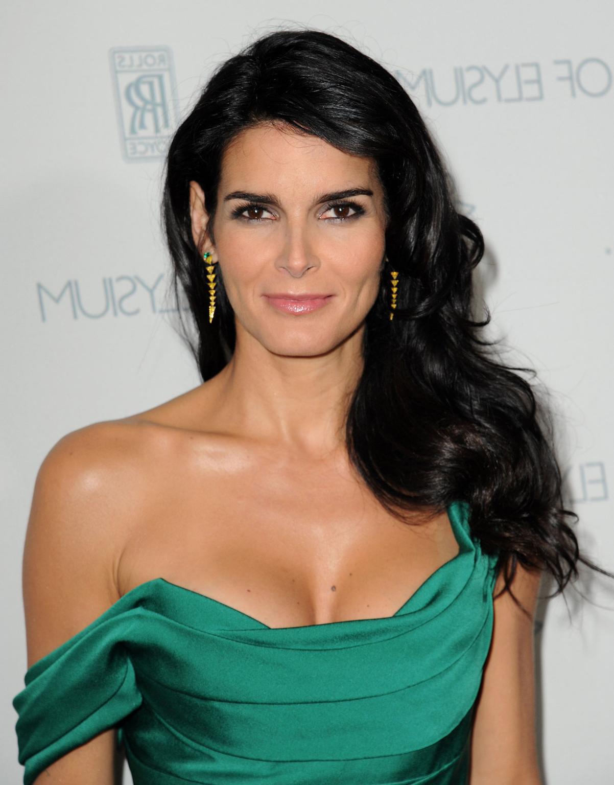 16P Angie Harmon busty wearing a low cut dress at The Art Of Elysium presentation of