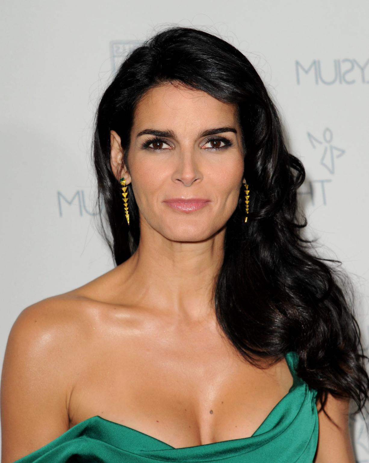 16P Angie Harmon busty wearing a low cut dress at The Art Of Elysium presentation of