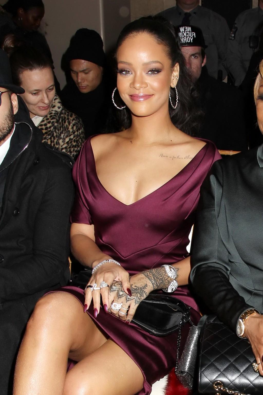 16P Rihanna showing cleavage and upskirt at the Zac Posen Fashion Show in NYC