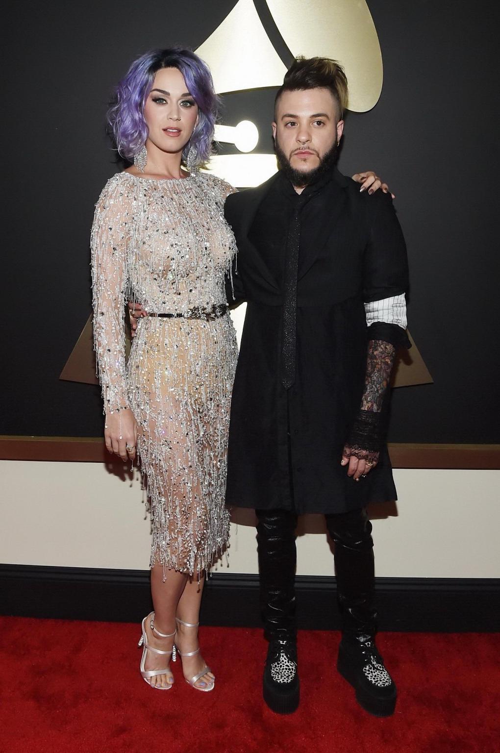 16P Katy Perry shows off her curvy body wearing a skin colored corset and a cthru dr