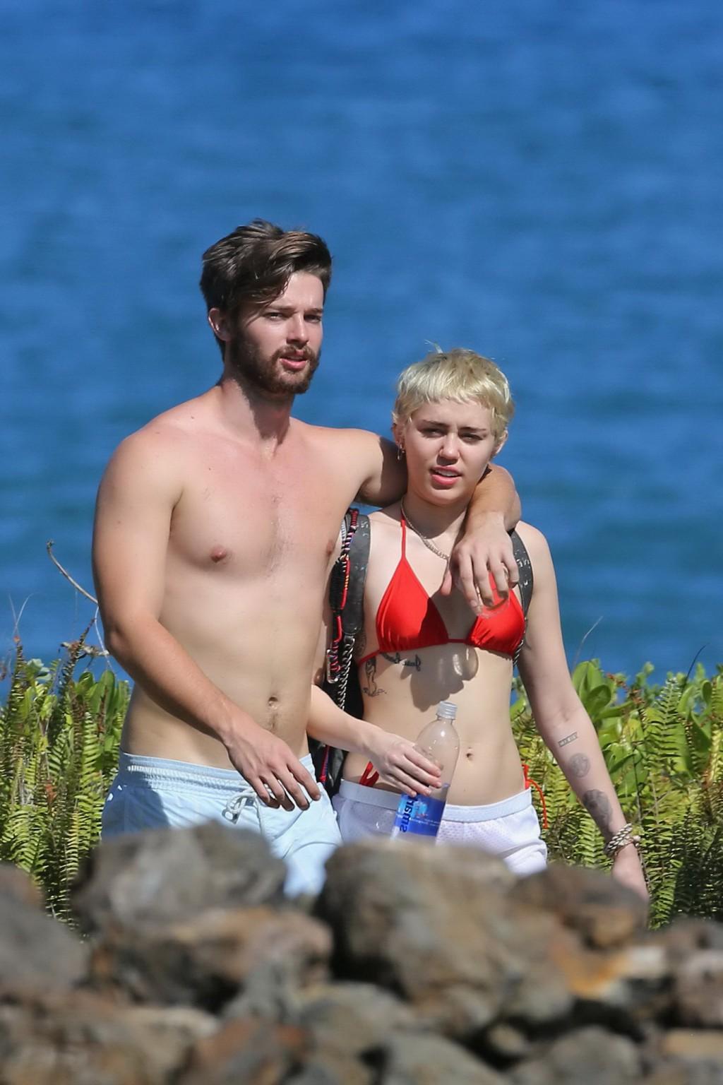 16P Miley Cyrus wearing tiny red bikini and seethrough shorts at a vacation in Hawai