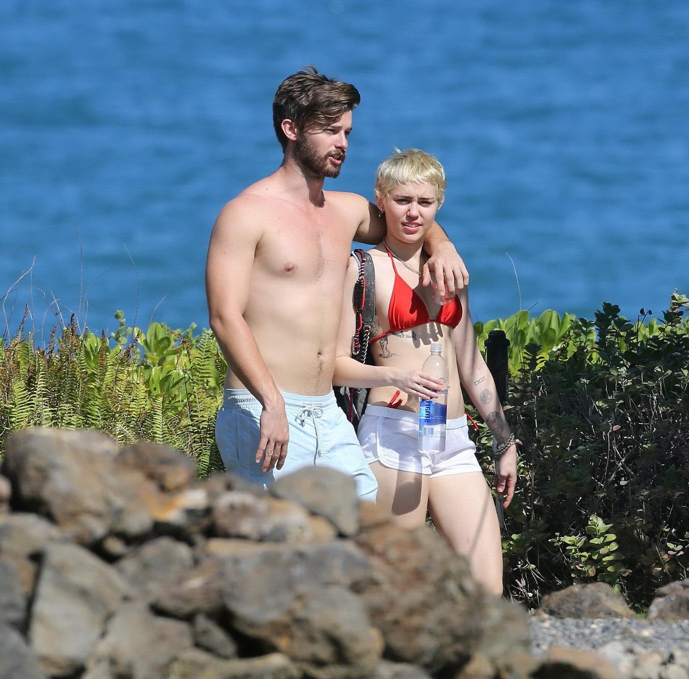 16P Miley Cyrus wearing tiny red bikini and seethrough shorts at a vacation in Hawai