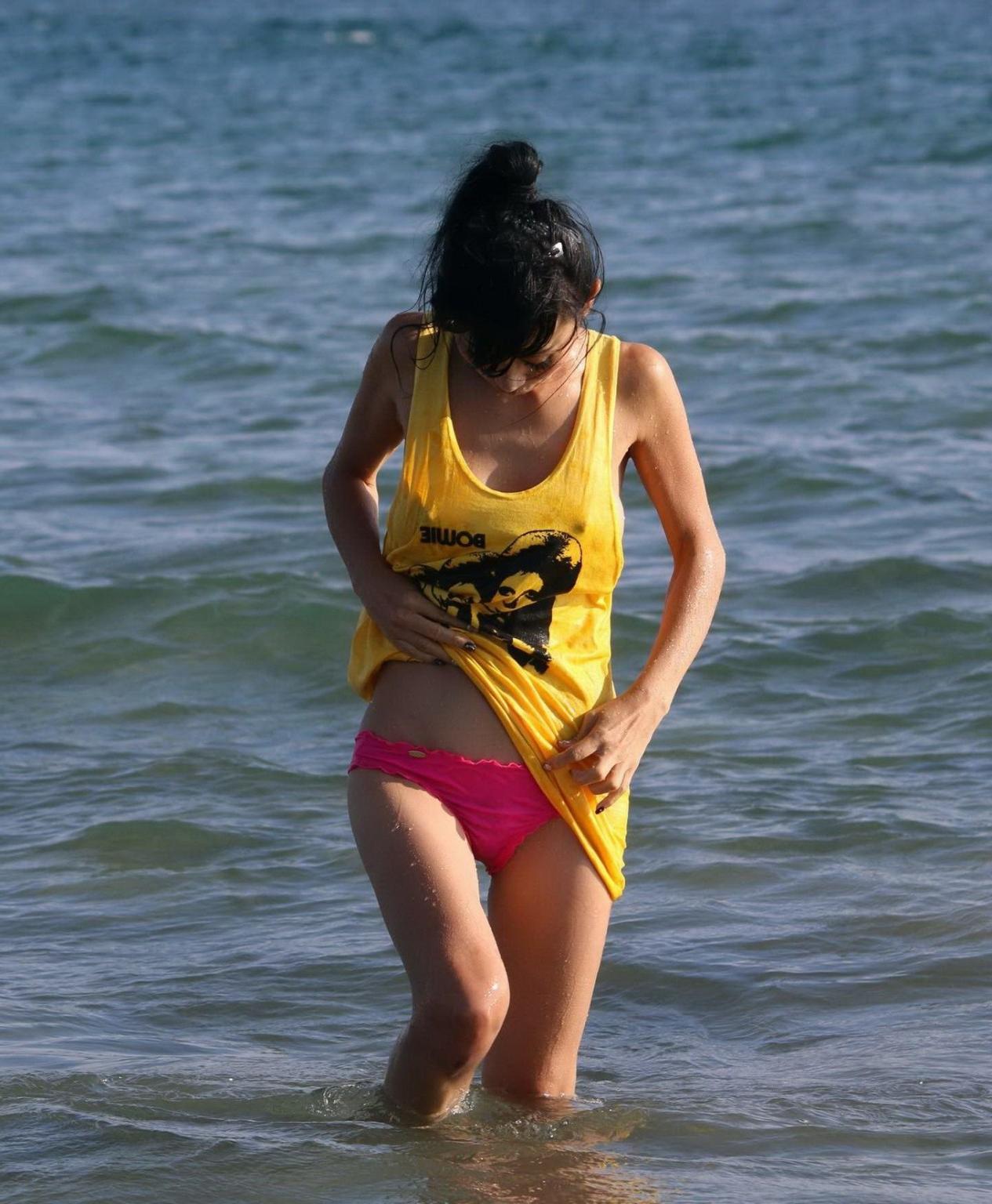 16P Bai Ling shows sideboob and pokies in wet tshirt and bikini bottom at the beach 