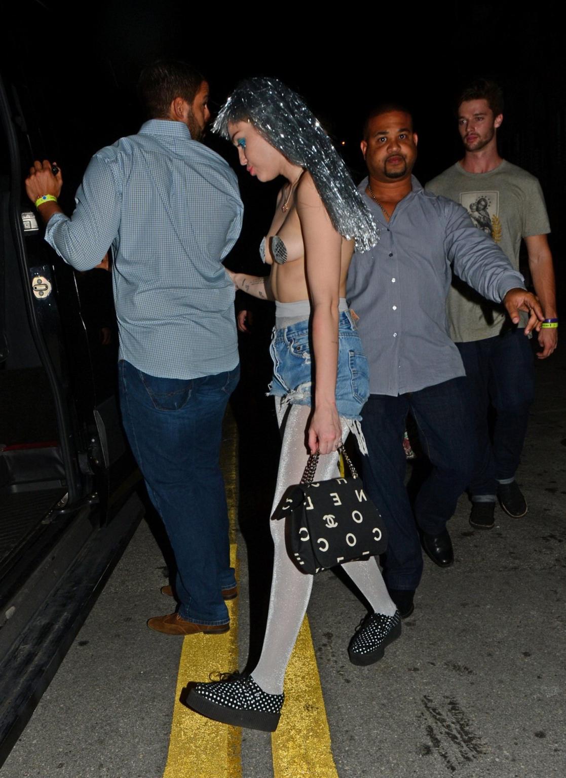 16P Miley Cyrus topless but wearing pasties and pantyhose at Art Basel in Miami