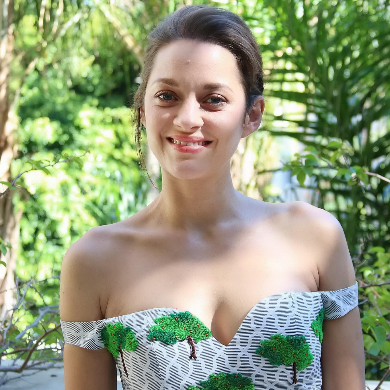 16P Marion Cotillard braless wearing sexy off shoulder dress at the Two Days One Nig